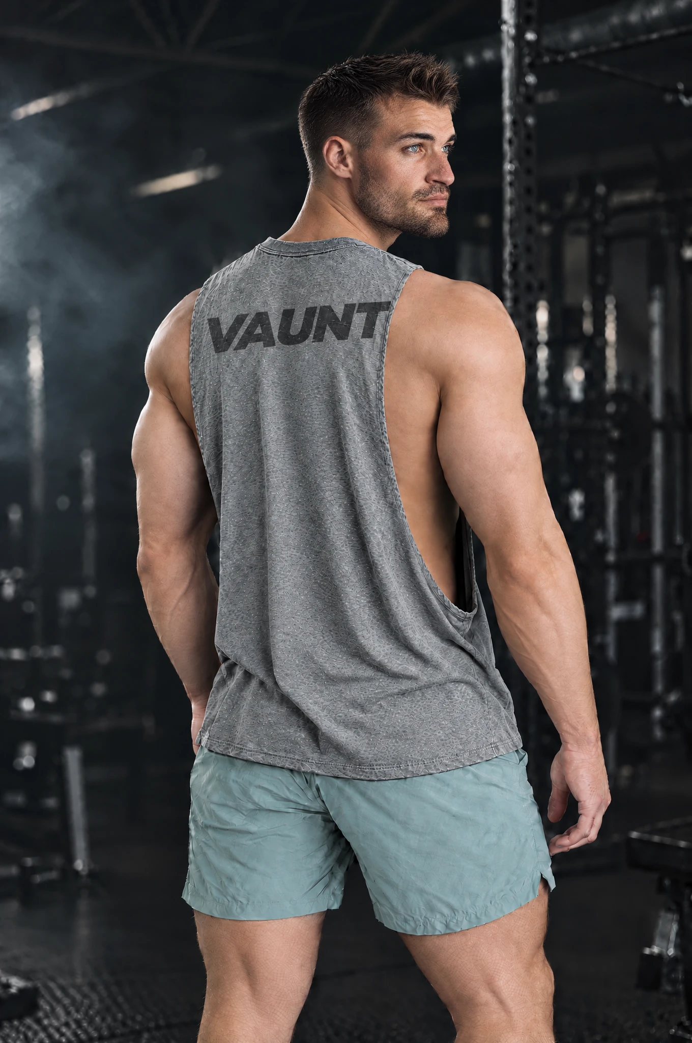 Kyle wearing the Heather Grey Signal Cutoff, back view over the shoulder
