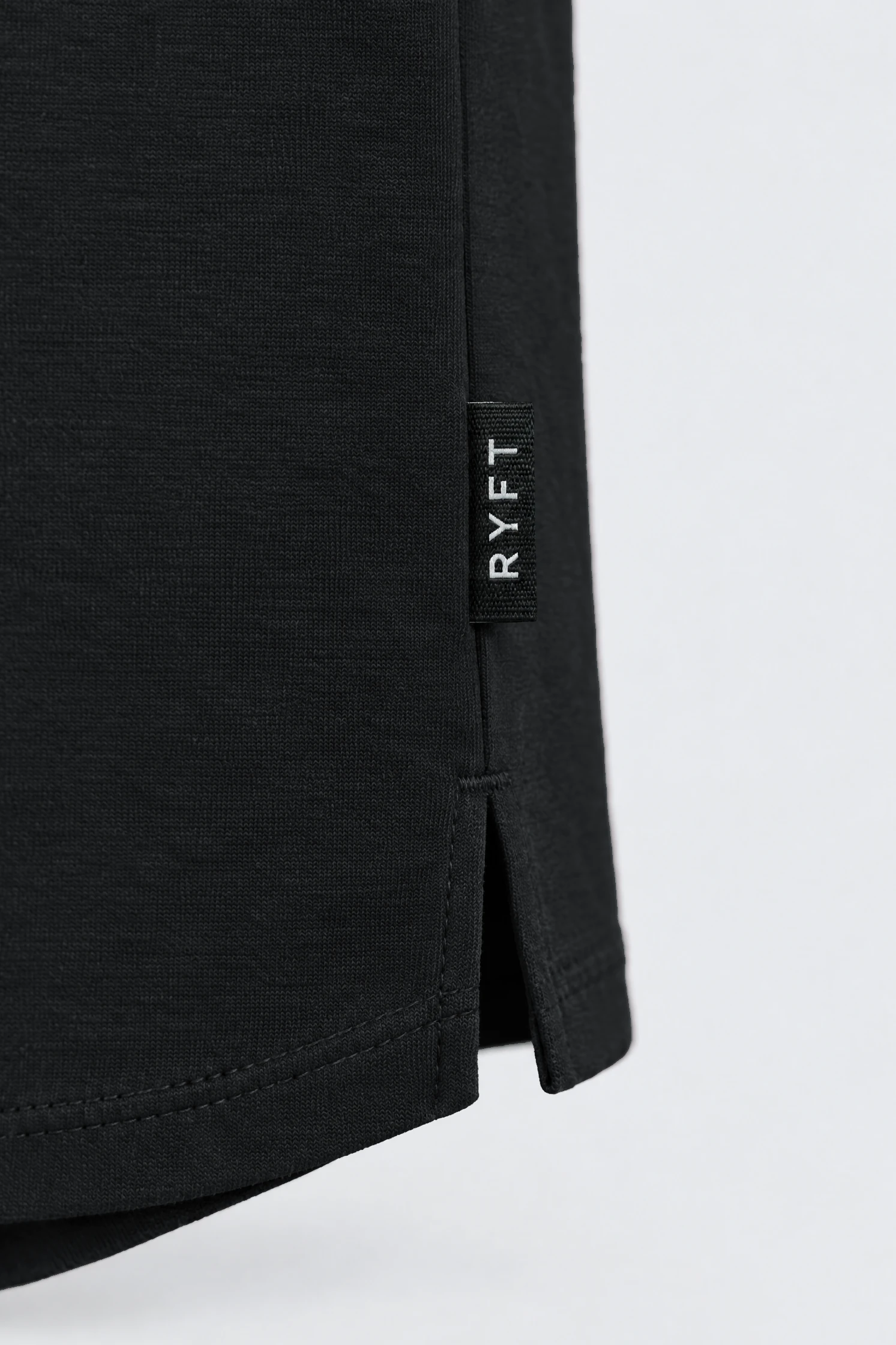 Obsidian Training Tee in Onyx, side seam tab detail