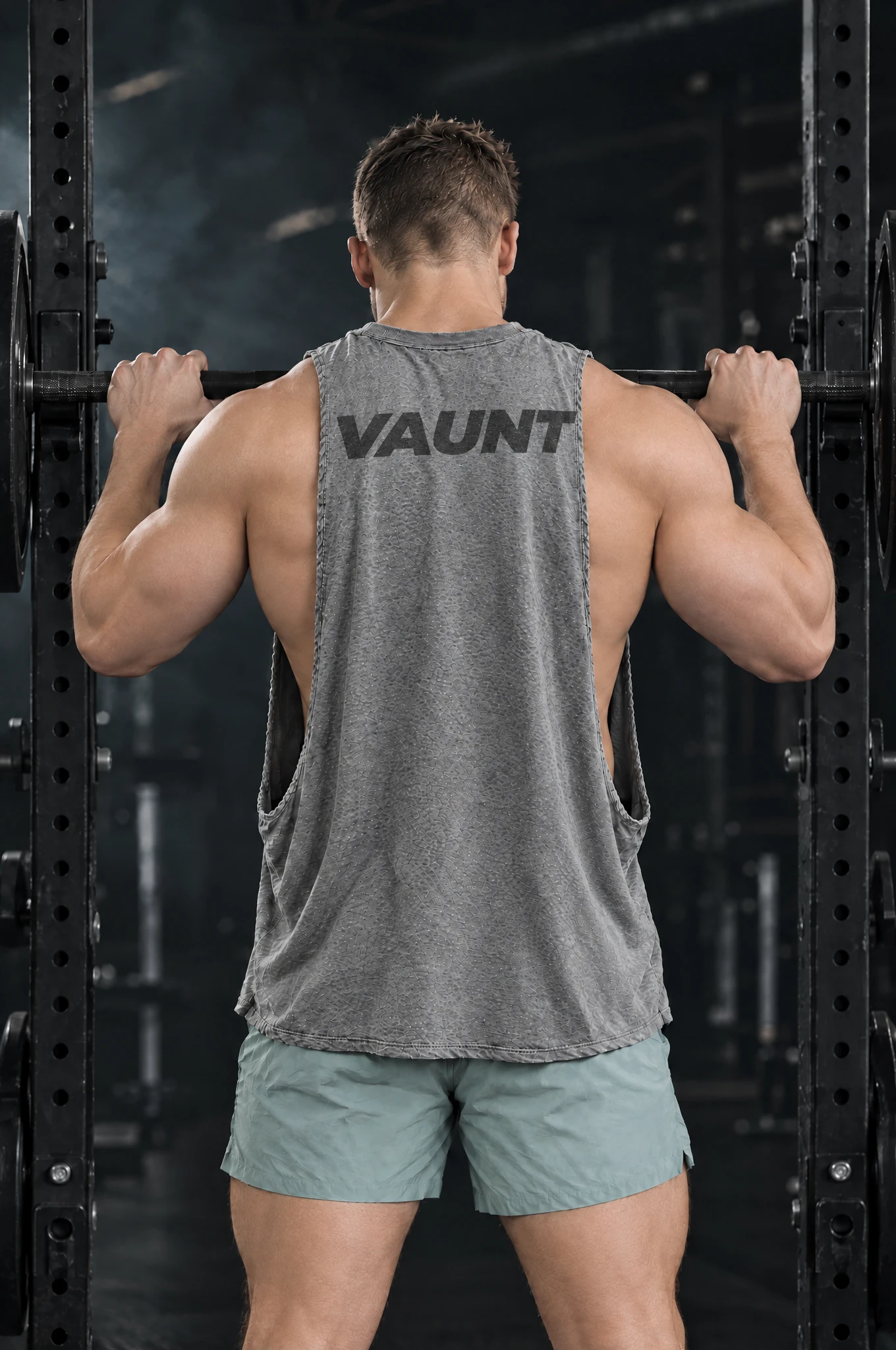 Kyle wearing the Heather Grey Signal Cutoff at the squat rack, back view